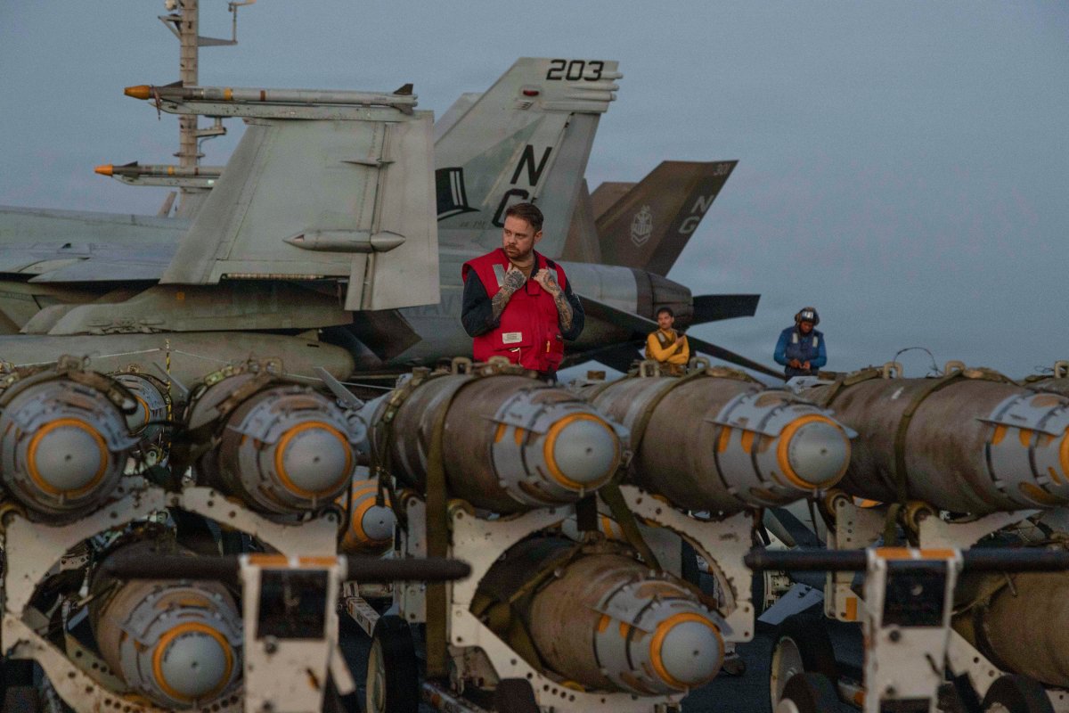 Ordnance handlers stage munitions on USS Abraham Lincoln during Operation Epic Fury, Feb. 27, 2026